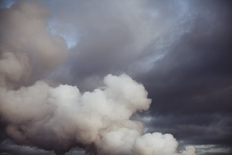 Dark and light clouds in a cloudy sky.